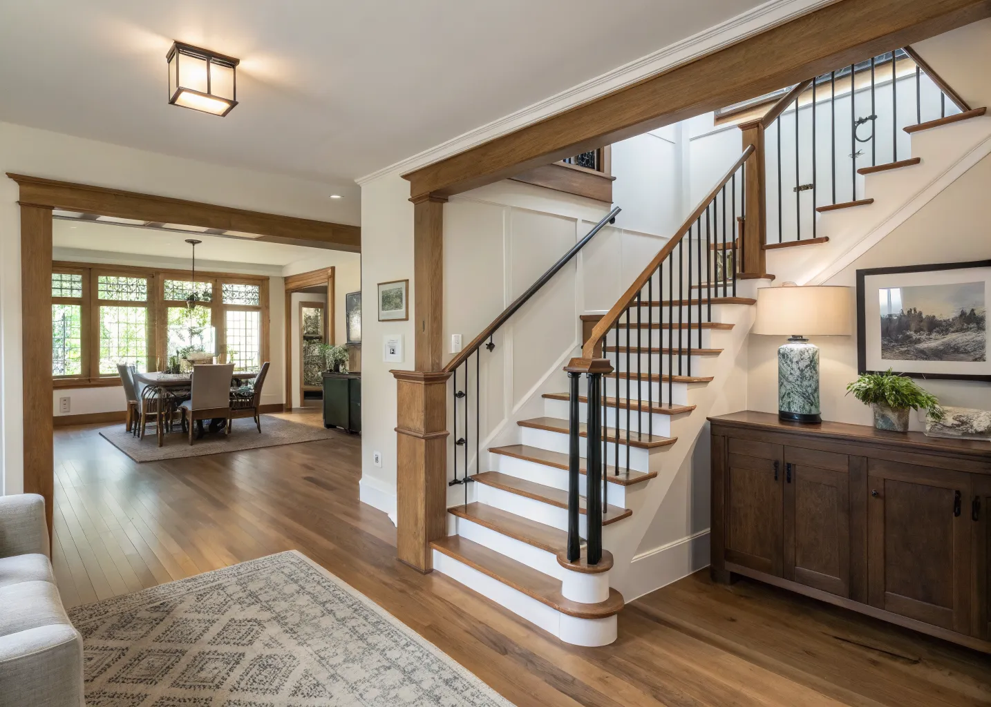 Renovated main floor with a white oak and black steel open staircase